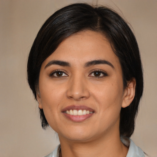 Joyful asian young-adult female with medium  black hair and brown eyes