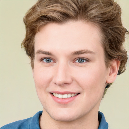 Joyful white young-adult female with short  brown hair and blue eyes