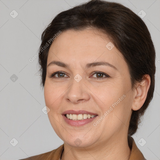 Joyful white adult female with medium  brown hair and brown eyes