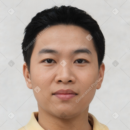 Joyful asian young-adult male with short  black hair and brown eyes