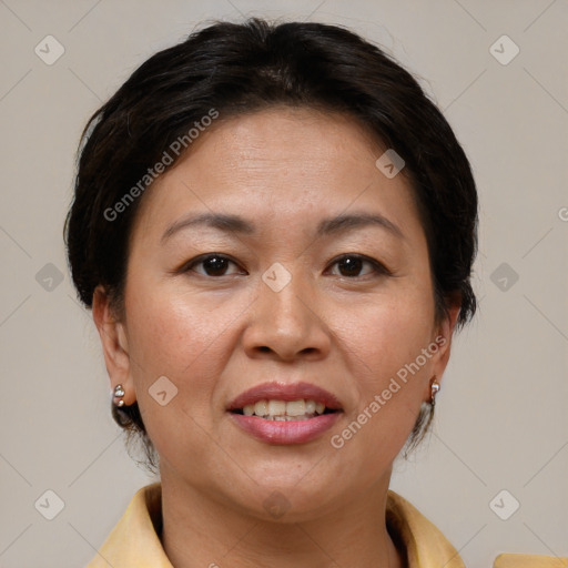 Joyful white adult female with short  brown hair and brown eyes