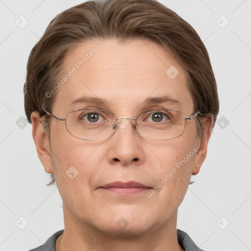 Joyful white adult female with short  brown hair and grey eyes