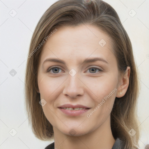 Joyful white young-adult female with medium  brown hair and grey eyes