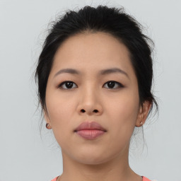 Neutral asian young-adult female with medium  brown hair and brown eyes