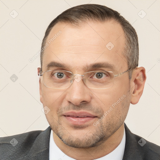 Joyful white adult male with short  brown hair and brown eyes