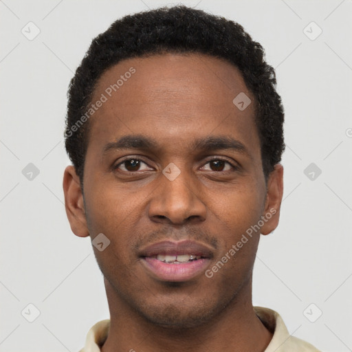Joyful black young-adult male with short  black hair and brown eyes