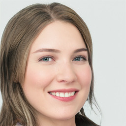 Joyful white young-adult female with long  brown hair and green eyes