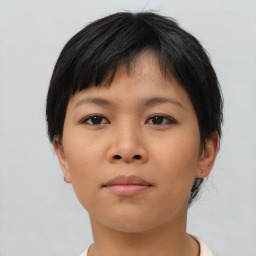 Neutral asian young-adult female with medium  brown hair and brown eyes