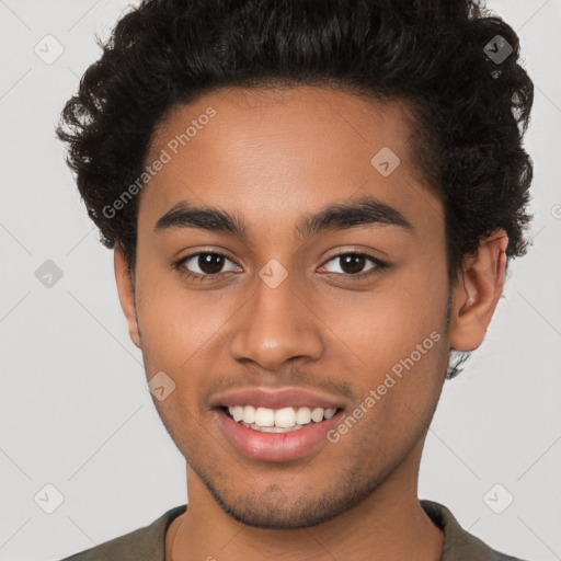 Joyful latino young-adult male with short  brown hair and brown eyes