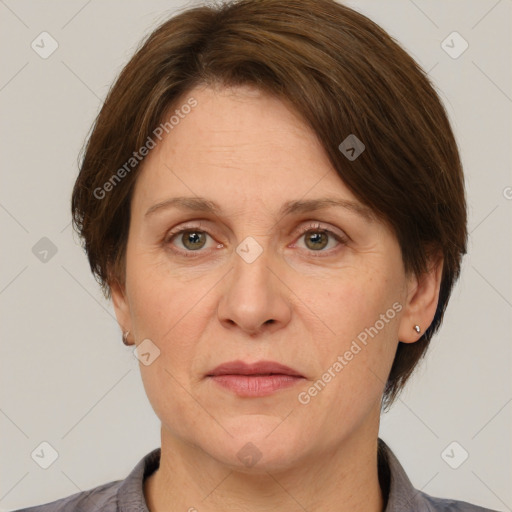 Joyful white adult female with short  brown hair and grey eyes