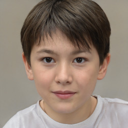 Joyful white child male with short  brown hair and brown eyes