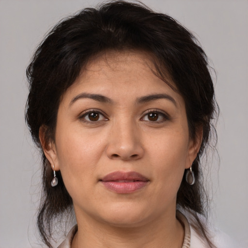 Joyful white adult female with medium  brown hair and brown eyes
