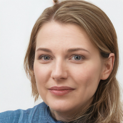 Joyful white young-adult female with medium  brown hair and blue eyes