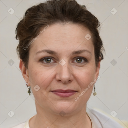 Joyful white adult female with short  brown hair and grey eyes