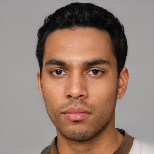 Neutral latino young-adult male with short  black hair and brown eyes