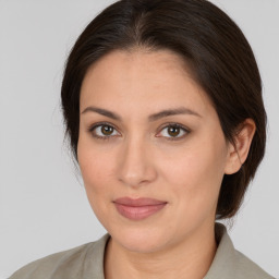 Joyful white young-adult female with medium  brown hair and brown eyes