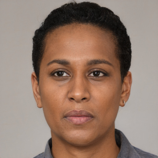 Neutral black young-adult female with short  black hair and brown eyes