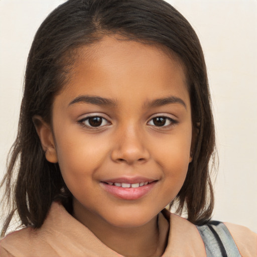 Joyful latino child female with long  brown hair and brown eyes