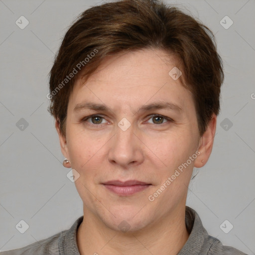 Joyful white adult female with short  brown hair and grey eyes