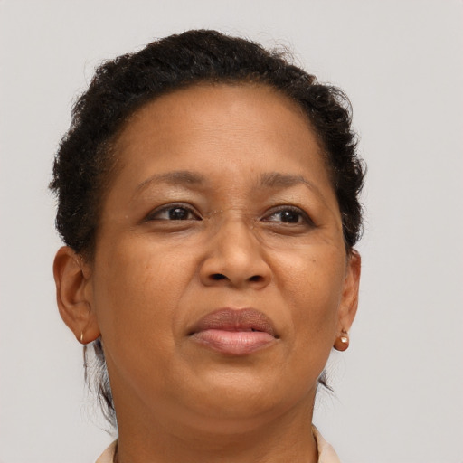 Joyful black adult female with short  brown hair and brown eyes