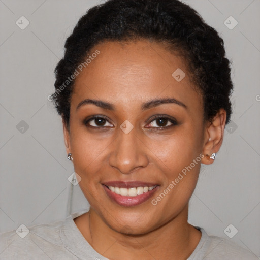 Joyful black young-adult female with short  brown hair and brown eyes