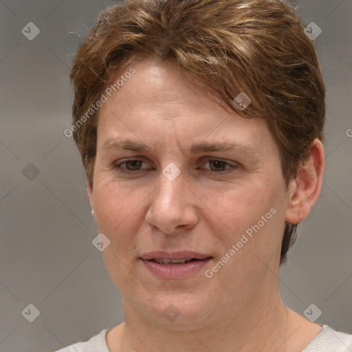 Joyful white adult female with short  brown hair and grey eyes