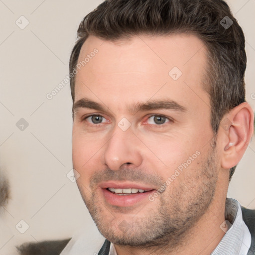 Joyful white adult male with short  brown hair and brown eyes