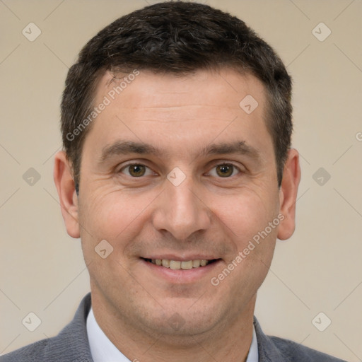 Joyful white adult male with short  brown hair and brown eyes