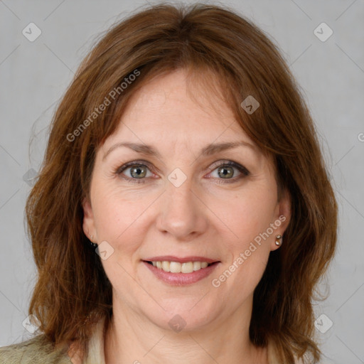 Joyful white adult female with medium  brown hair and grey eyes