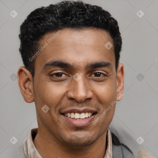 Joyful latino young-adult male with short  brown hair and brown eyes