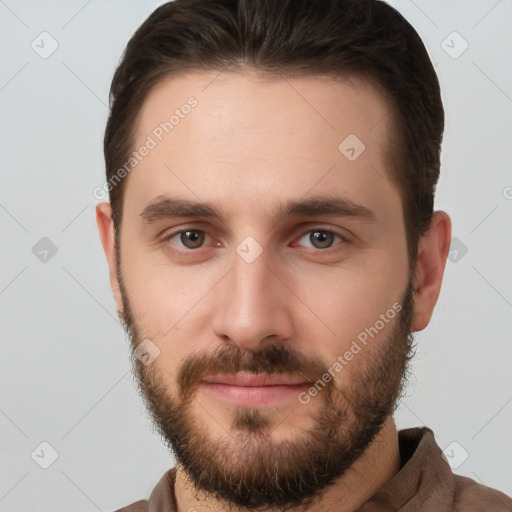 Joyful white young-adult male with short  brown hair and brown eyes