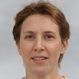 Joyful white adult female with short  brown hair and brown eyes