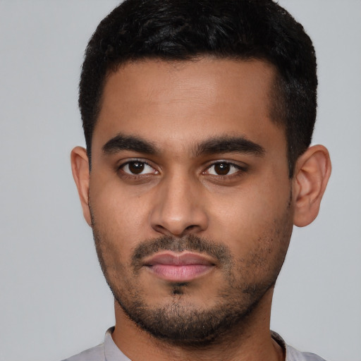 Neutral latino young-adult male with short  black hair and brown eyes