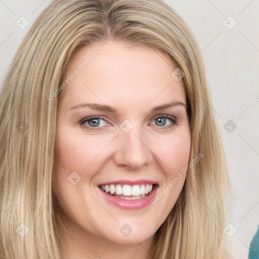 Joyful white young-adult female with long  brown hair and green eyes