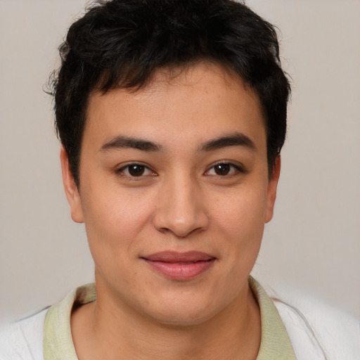 Joyful asian young-adult male with short  brown hair and brown eyes