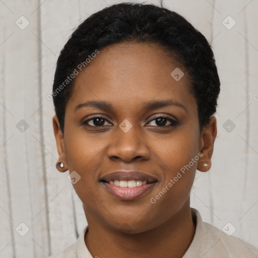 Joyful black young-adult female with short  brown hair and brown eyes