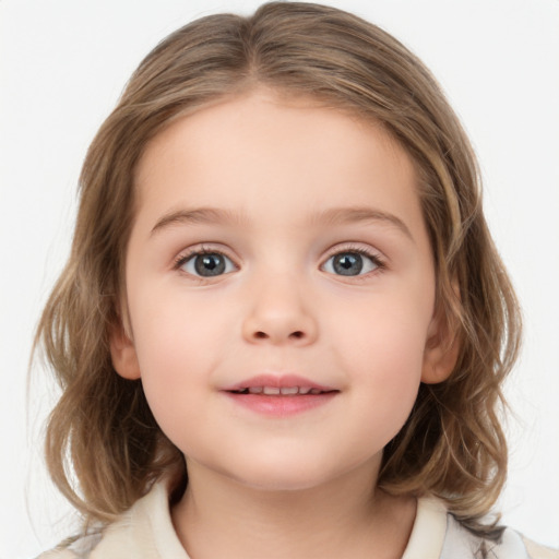 Joyful white child female with medium  brown hair and blue eyes