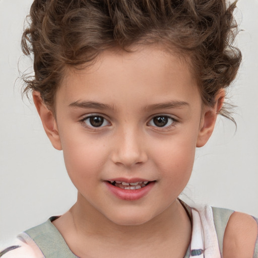 Joyful white child female with short  brown hair and brown eyes