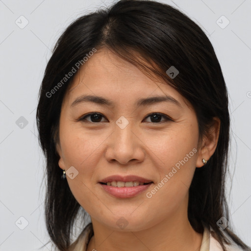 Joyful white adult female with medium  brown hair and brown eyes