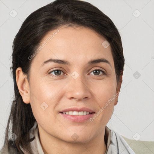 Joyful white adult female with medium  brown hair and brown eyes