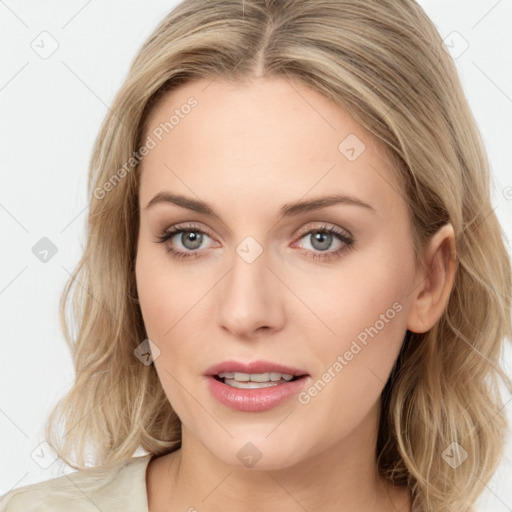 Joyful white young-adult female with long  brown hair and blue eyes