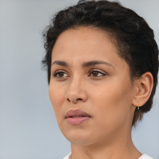 Neutral white young-adult female with short  black hair and brown eyes