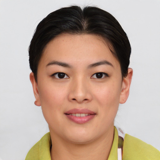 Joyful asian young-adult female with short  brown hair and brown eyes