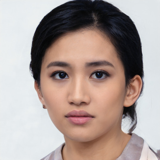 Neutral asian young-adult female with medium  black hair and brown eyes