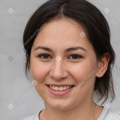 Joyful white young-adult female with medium  brown hair and brown eyes