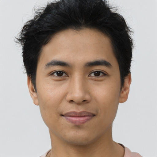 Joyful asian young-adult male with short  black hair and brown eyes