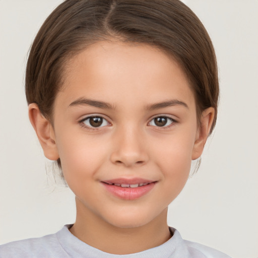 Joyful white child female with short  brown hair and brown eyes