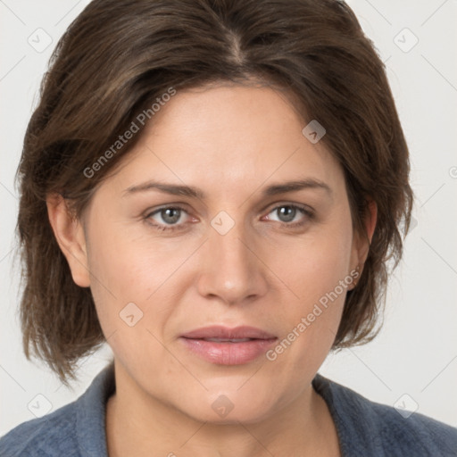 Joyful white adult female with medium  brown hair and grey eyes