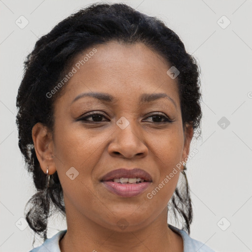 Joyful black adult female with short  brown hair and brown eyes