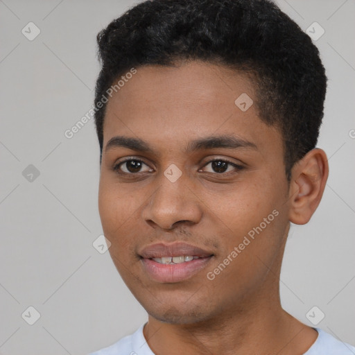 Joyful black young-adult male with short  black hair and brown eyes